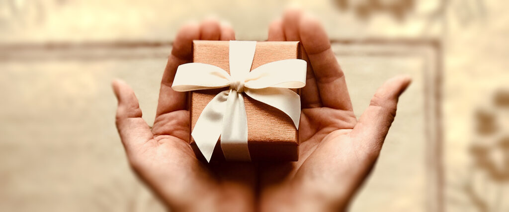 hands with gift cropped